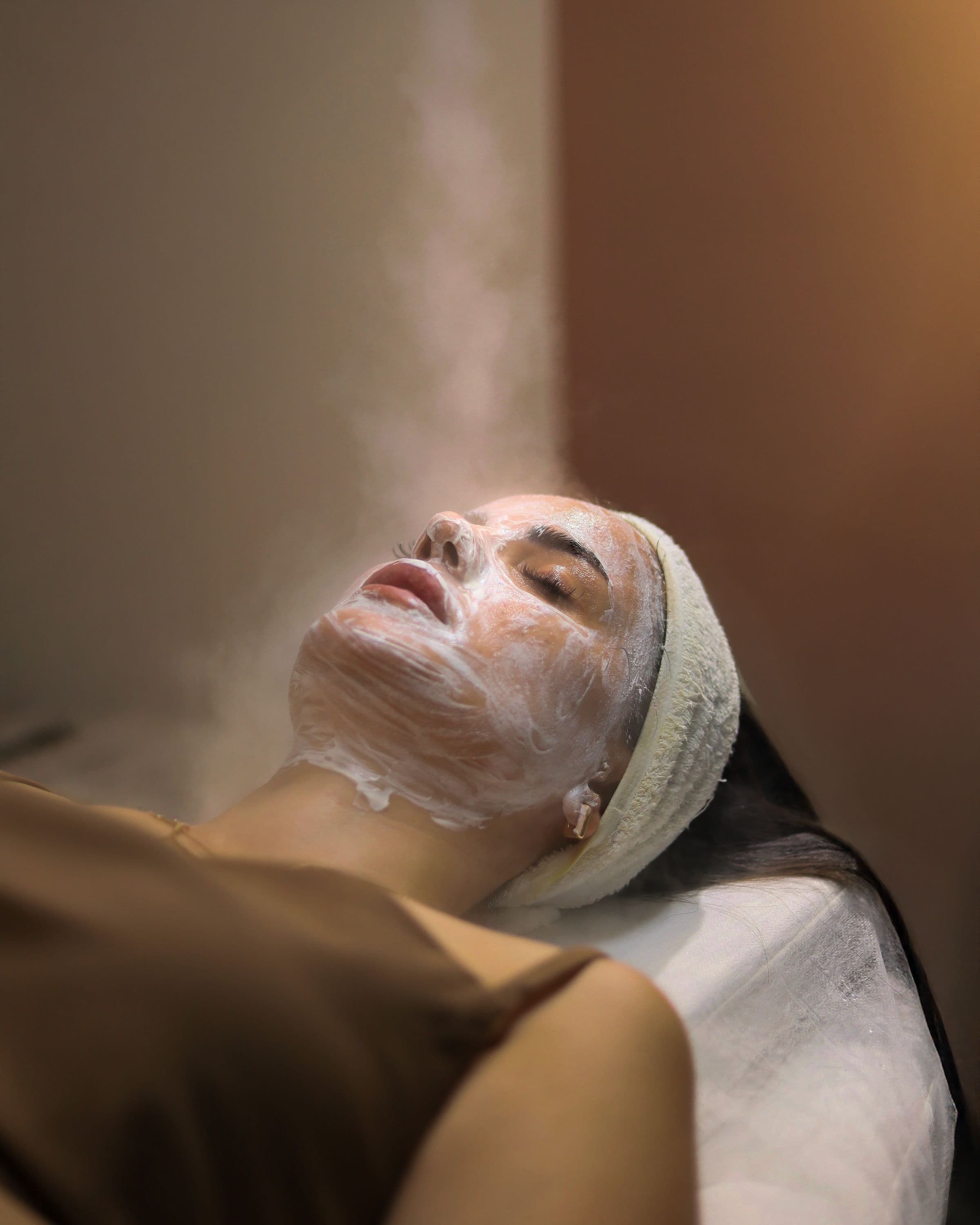 Skincare tools and botanical ingredients used in a Salt & Bloom facial